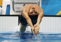 男子１００メートル背泳ぎ準決勝を全体４位で通過した入江（ロイター）